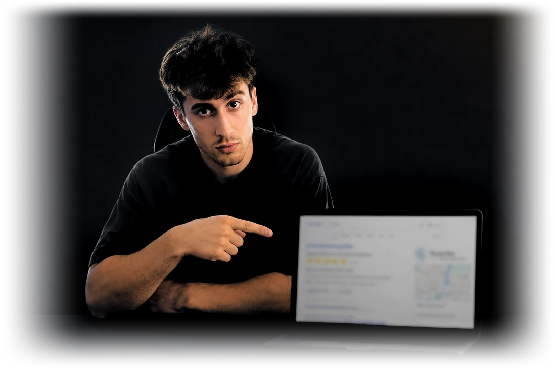 Christian Packard pointing at a laptop showing local search results